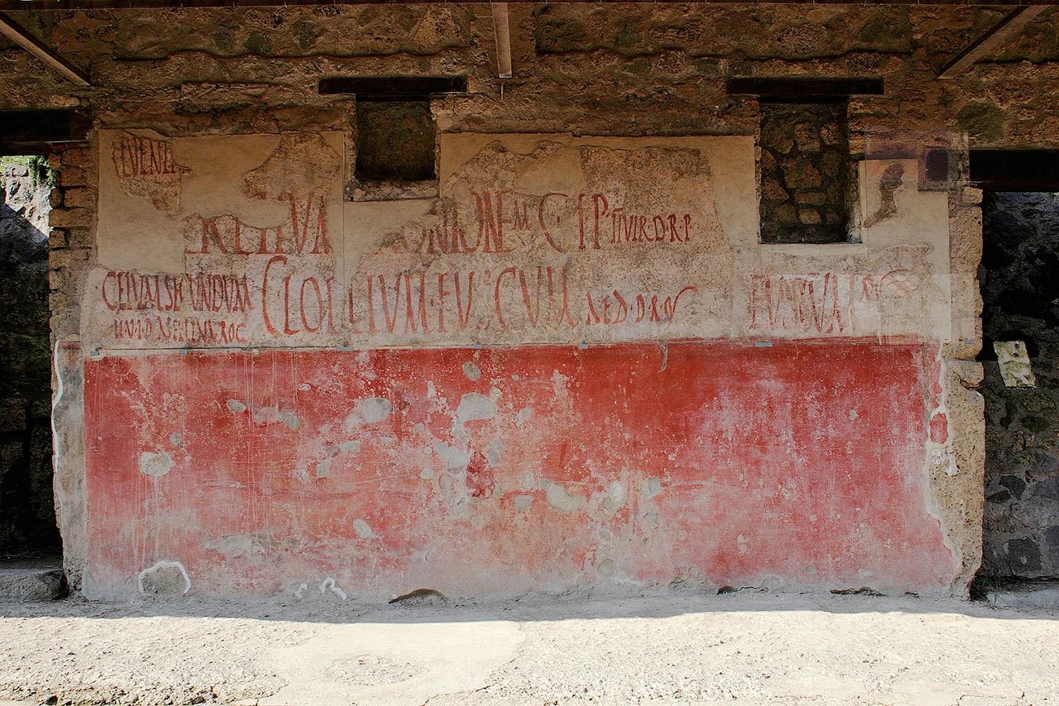 Graffiti på vägg i Pompeji.