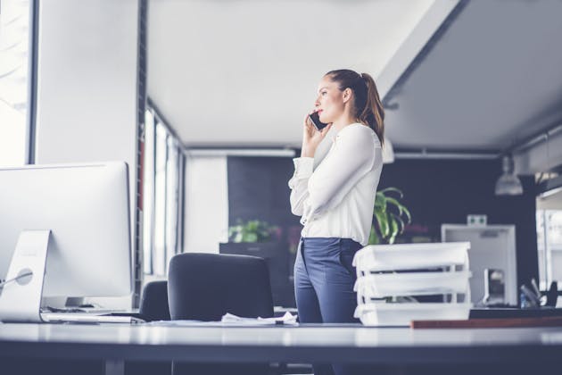 Woman stands at work